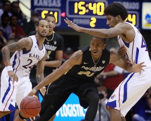 Kansas's Kevin Young, right, stops Colorado's Spencer Dinwiddle during the second half of a men's college basketball game at Allen Fieldhouse on Saturday, December 8, 2012, in Lawrence, Kansas. The Kansas Jayhawks beat the Colorado Buffaloes, 90-54.