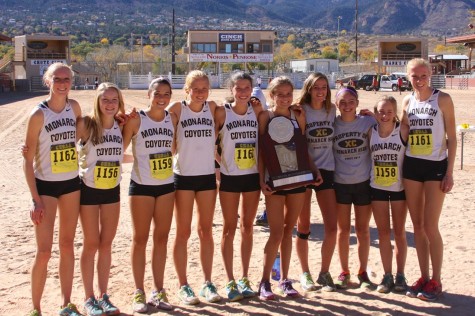 Members of the Monarch girl's cross country team Karina Mann (far left), Holly Bent, Lizzy Hogan, Daisy Fuchs, Audrey Lookner, Alden Gruidel, Jensen Avey, Sam Wexler, Abby Hein, and Elissa Mann pose with their second place trophy. The boy's team took 13th place at state.