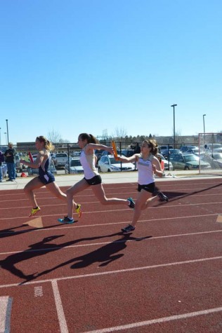 Tatiana Cherry-Santos hands off to Danielle Honan in the 4X100 relay.