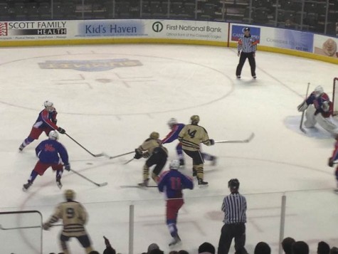 The Monarch Coyotes attempt to break through the Cherry Creek Bruin’s defense during the 2015 Colorado Ice Hockey State Championships. Photo by: Journey Diller