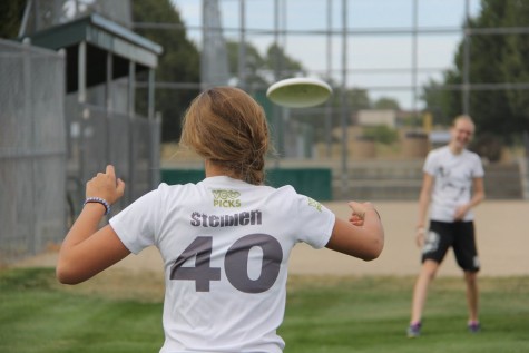 Seniors Mailys Steiblen and Ellie Stanish warm up before a game at the Louisville Sports Complex.