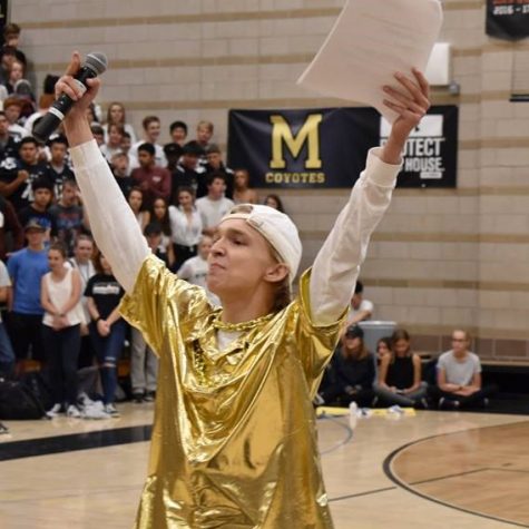 Head boy Connor Moore '19 hypes up the crowd during the Homecoming Assembly.
