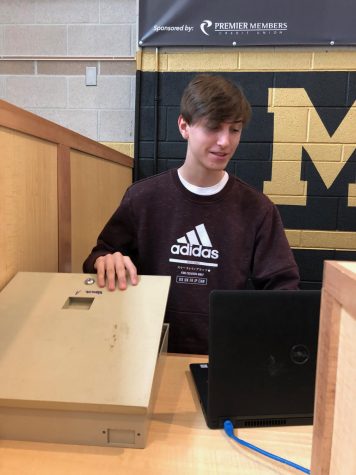 Breccan Corzine '21works as a teller at Premier Members Credit Union.