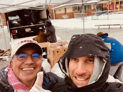 Mr. Redouan Bouchta and Mr. David Tencer distribute food to families in need over Spring Break. This photo was taken before strict guidelines for social distancing and wearing masks were established for Colorado.