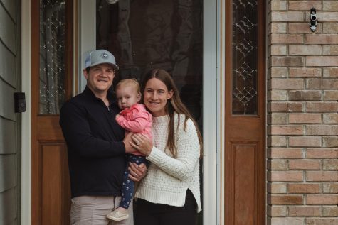 A toddler in hand, a baby on the way