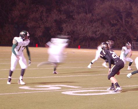 Junior cornerback Jake Hummel (#26) drops into coverage against Falcons Jamal Maddox. Hummel had a key play in the first quarter, breaking up a pass on fourth-and-two. Junior Ethan Marks scored a touchdown on the very next play.