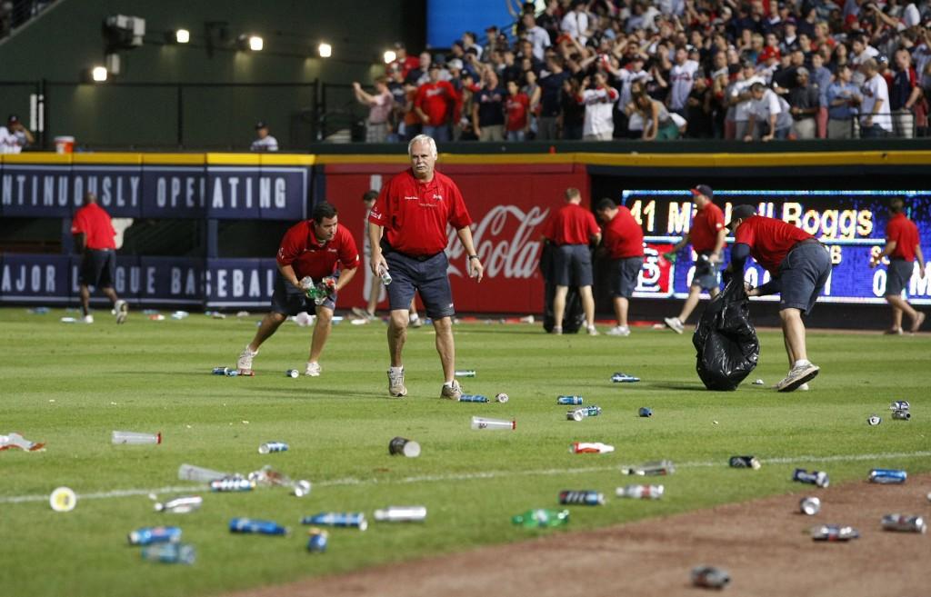 Atlanta+Braves+ground+crew+members+clean+trash+off+the+field+after+fans+littered+the+area+protesting+an+infield+fly+rule+call+on+the+Braves+Andrelton+Simmons+in+the+eighth+inning+against+the+St.+Louis+Cardinals+in+the+National+League+Wild+Card+game+at+Turner+Field+in+Atlanta%2C+Georgia%2C+Friday%2C+October+5%2C+2012.+Officials+ruled+Simmons+out+on+the+infield+fly+rule.+The+Cardinals+defeated+the+Braves%2C+6-3.