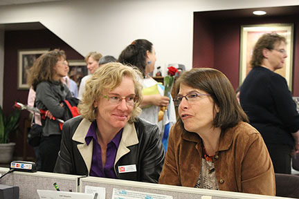 Laura Edwards, of Boulder, watches as Marie Banich, her partner, talks to a clerk during their Civil Union ceremony in the early morning hours of May 1st.