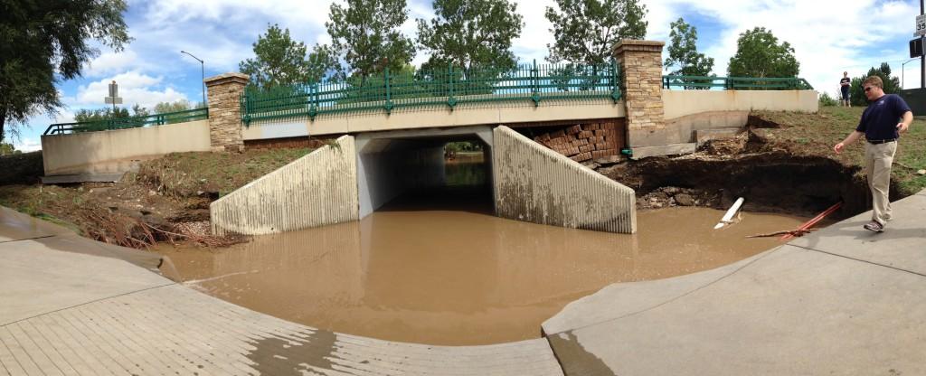 Flood water sits beneath a tunnel connecting the 18th green of Coal Creek Golf Course to the clubhouse area on September 13, 2013