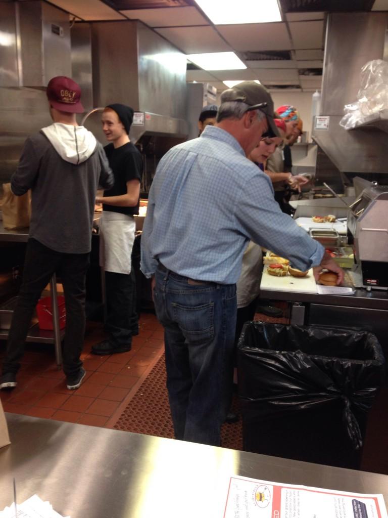 The new employees at Snarfburger putting their skills to the test as they quickly complete customers orders. Snarfburger is set to open officially for business on Tuesday, October 29th.