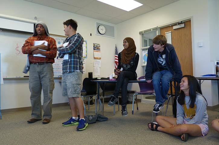 From right to left, No Place for Hate members Alana Chen, Drake Farrell, Heraa Hashmi, Andy Kim, and Cory Jones attend a training at the beginning of the year in 2012. Jones and Kim are demonstraing how to handle verbal sexual harassment. Jones is a trainer for NPFH.