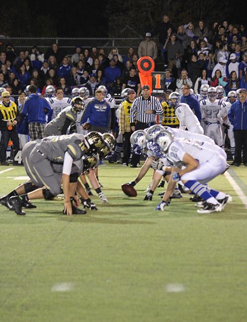 Monarchs defensive line prepares to rush the Broomfield quarterback on October 25th, 2013. The Broomfield center can be seen preparing to snap the ball to the quarterback.