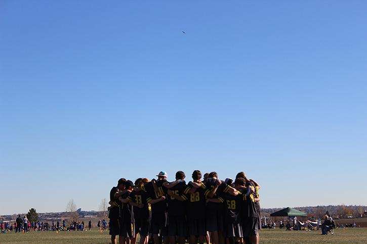 The entire Monarch Ultimate frisbee team huddles up to discuss the loss against Lakewood High School at Broomfield County Commons on Sunday, November 10th.