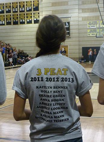 Senior Kaitlyn Benner looks on while wearing her 3-peat shirt for the cross country teams three consecutive state championships.