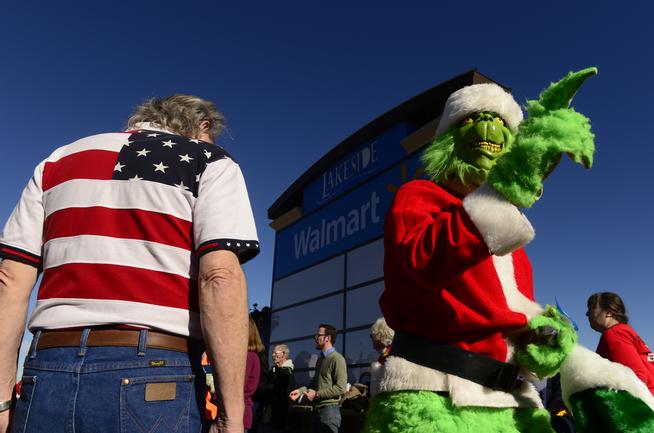 Community and labor groups demonstrate outside a Walmart store in Lakeside on Black Friday, Nov. 29, 2013. They were protesting the nations largest retailer on the busiest shopping day of the year. 
