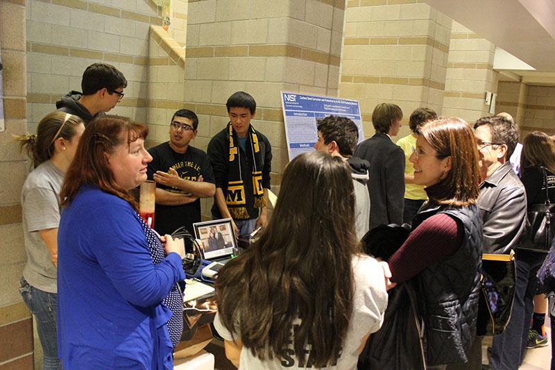 Biology teacher Kristin Donley and some of her students display the AP bio and senior research seminar classes that are offered at Monarch. On the other side of the hall Donley was also showing off the 3D technology that she is able to use in her teaching.
