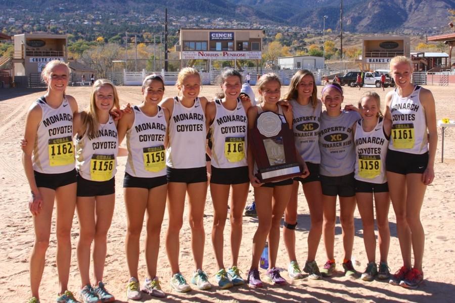 Members of the Monarch girls cross country team Karina Mann (far left), Holly Bent, Lizzy Hogan, Daisy Fuchs, Audrey Lookner, Alden Gruidel, Jensen Avey, Sam Wexler, Abby Hein, and Elissa Mann pose with their second place trophy. The boys team took 13th place at state. 