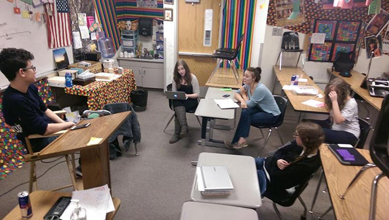 With Red Bull in the background, Jack Vanderveer, Madi Sinsel, Lauren Ortiz-Hunt, Meredith Marshall, and Elena Familetto work to write their one act. The groups worked late into the night to write and perfect their acts to later perform them for their friend and parents. 
