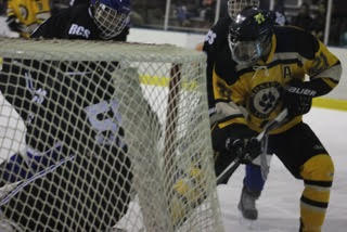 Defenseman Drew Wagner takes a shot at the goal during Monarchs second period offensive run.