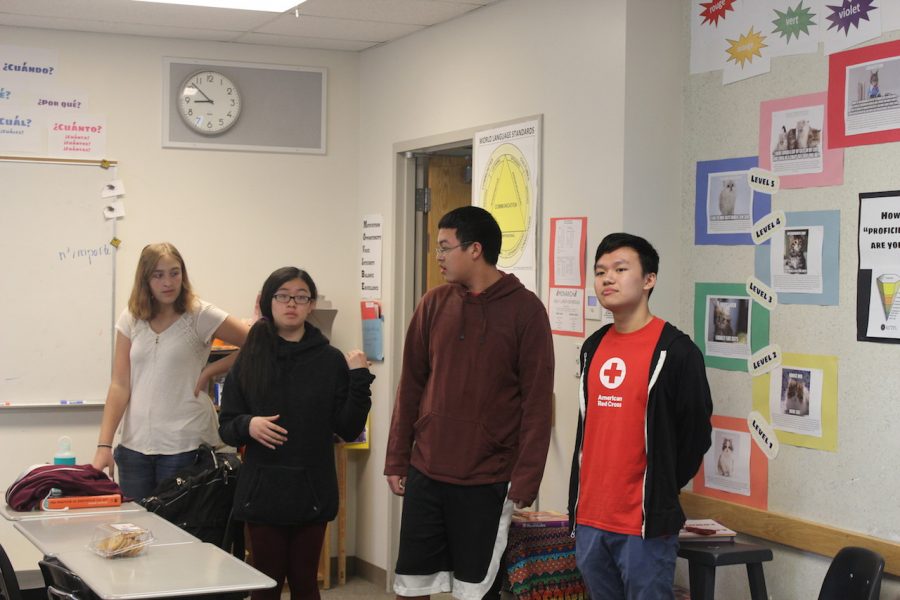 (Left to right) Mackenzie Ladouceur (12), Ivy Vien (12), Andrew Nong (12), and Ian Lee (12) talk to the students interested in joining the the Red Cross Club about what the club plans to do during the year, one of them being the Home Fire Campaign. “The Home Fire Campaign was really cool because we got really involved with the people. You go down there and talk with the people,” said Vien.