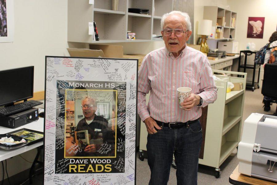 Dave Wood poses with a photo signed by the Monarch staff 