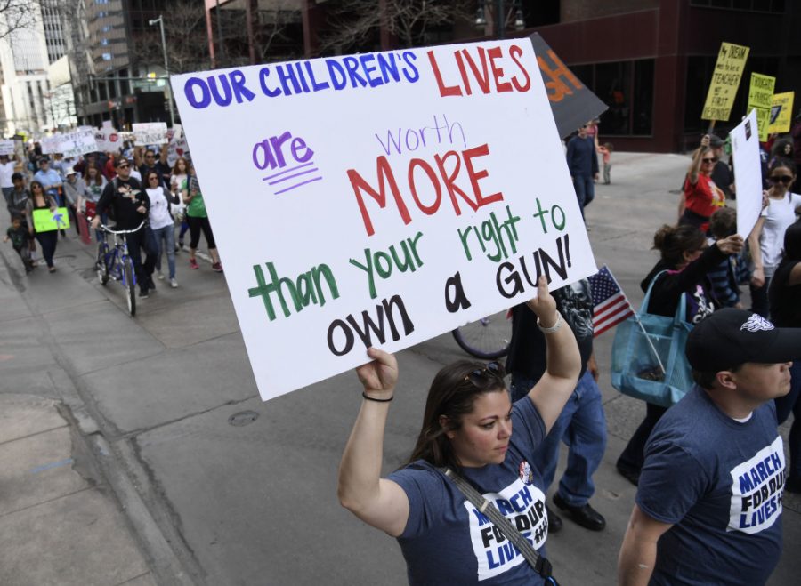 DENVER, CO - MARCH 24: Protesters had up 17th Ave for the March for Our Lives to end gun violence March 24, 2018. The student-led rally and march is one of more than 400 sister demonstrations taking place across the country March 24 in partnership with the Washington DC march that is organized by the student survivors of the February 14 shooting in Parkland, Florida. (Photo by Andy Cross/The Denver Post via Getty Images)