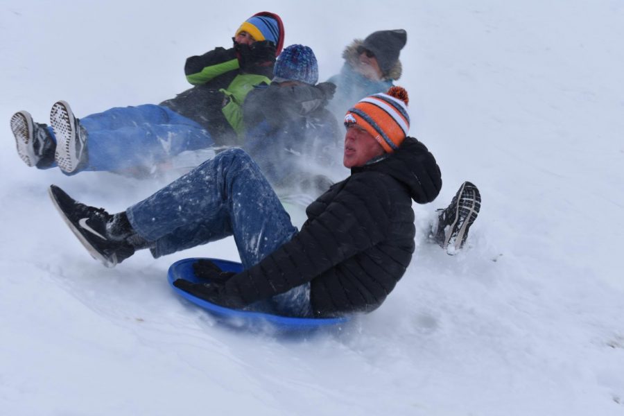 Band member Nathan Dankers 20 and others sled down a hill in Purple Park in Superior. While it was a small consolation for the canceled Marching Band State Championships, the students said they enjoyed the day in the powder.