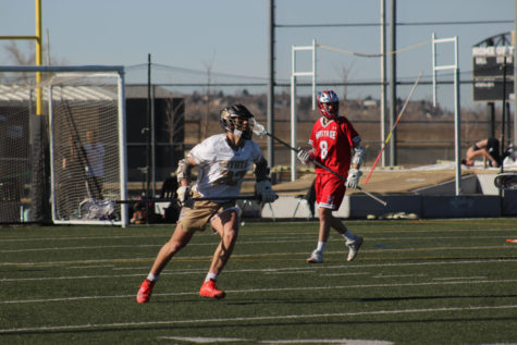 Sam Riecken ‘22 plays in a home game against Heritage High School on March 14. 