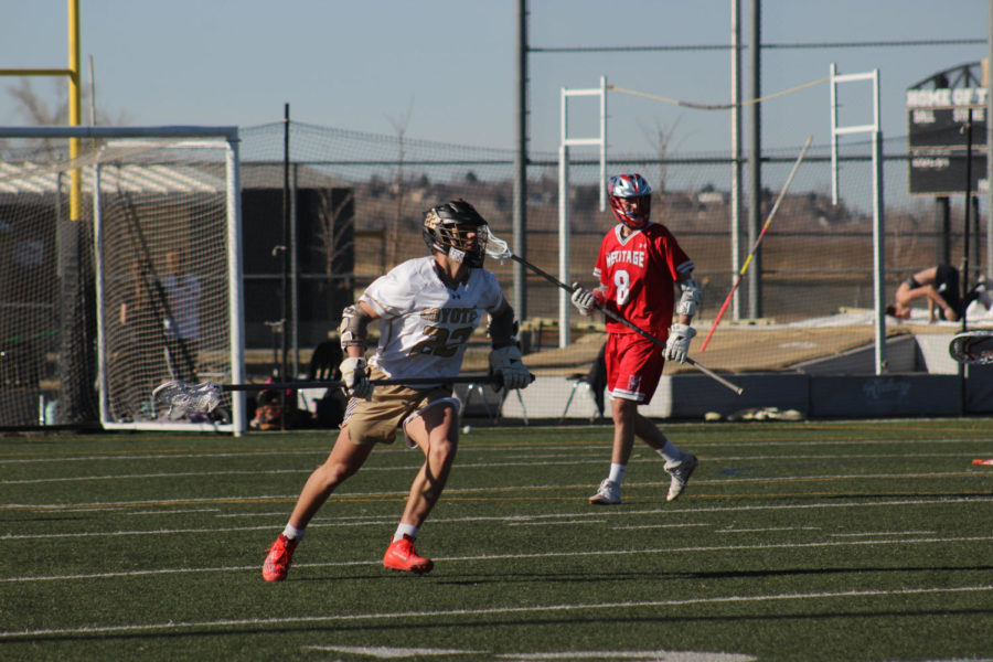 Sam Riecken ‘22 plays in a home game against Heritage High School on March 14. 