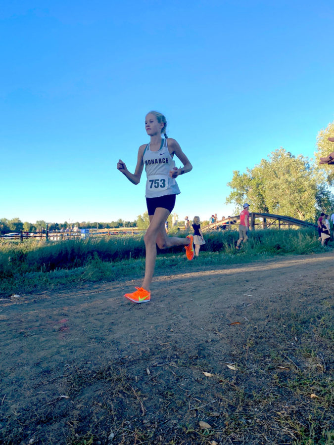 Sofie Donker ‘25, runs a 5K at a cross country meet. After moving from Norway, she has improved drastically.