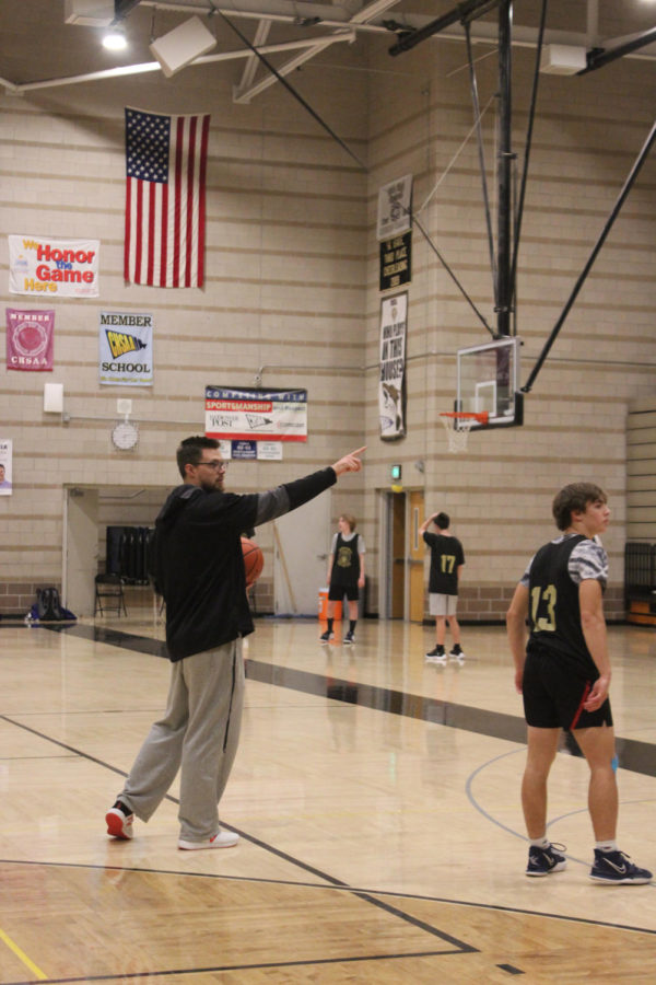 Basketball coach Sean Duncan leads after-school practice. This is his first year coaching basketball ever.