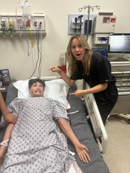 Eliza Lennox ‘25 practices taking vitals at UCLA’s campus. Lennox participated in Worldstrides Youth Medicine Program, where students all over the country get to try out real medical training.