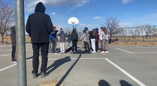 A group of students at Monarch PK-8 gather during recess, chanting “sacrifice” and “Hail Satan.” Seventh grader Emily Frost filmed as the unusual events unfolded. Little did she know that later, when the video was posted online, it would receive significant attention. 