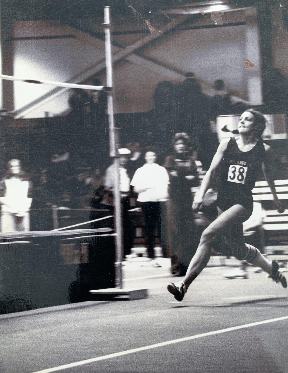 Annette Bank gets ready to perform a high jump at an international track meet in the 1970s. After a long career that included several Olympic competitions, Bank now coaches Monarch athletes.