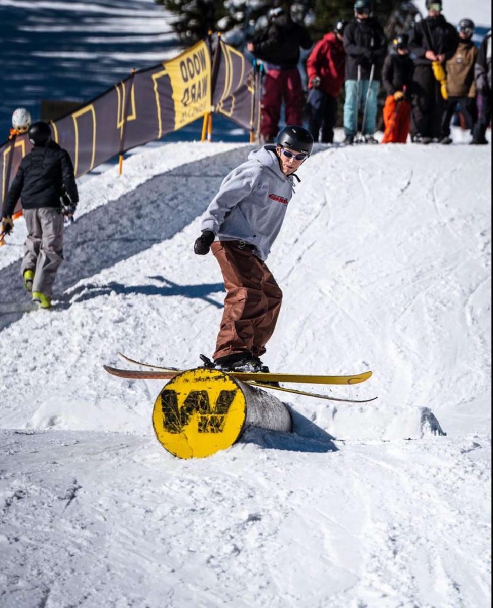 Free ride Club leader Drew Smith (12) grinds rail and spins off at Eldora. The club goes up to the mountains once a week to practice their skills and connect with other skiers.