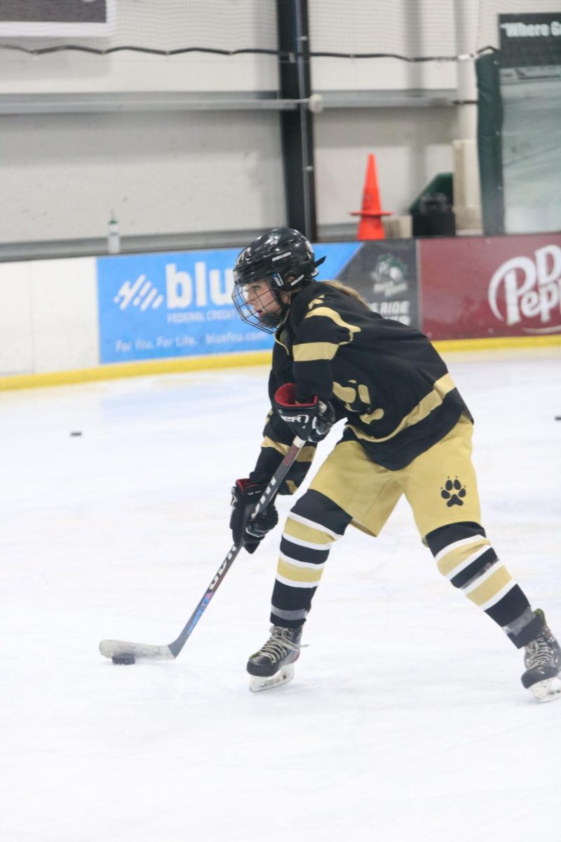 Sami Alegranti (12) works on her puck-handling skills at hockey practice on Dec. 6.