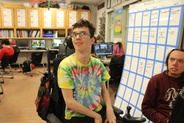 Scott Culver (11) edits his latest video project for KYOT. In spite of the physical limitations cerebral palsy has imposed on his life, Culver has found success as a video editor and sports reporter.