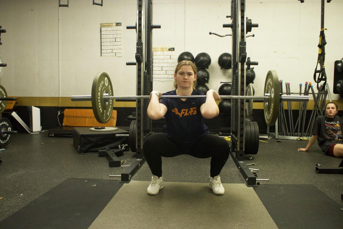  Mackenzie O’Reilly (10) pushes her strength during the new Weightlifting Club.